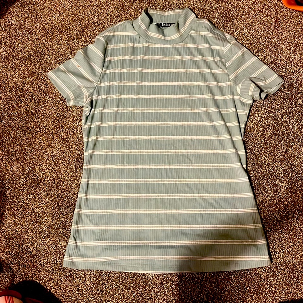 Feel and white striped shirt.